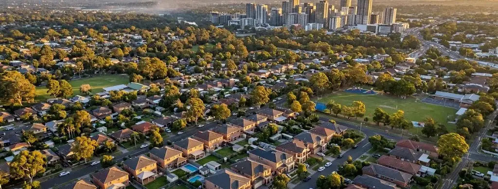 Aerial view of Western Sydney suburbs with the Parramatta skyline